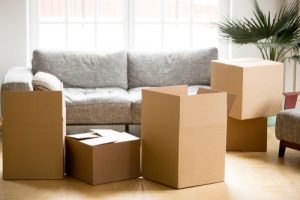 Cardboard,carton,boxes,with,personal,belongings,household,stuff,in,modern