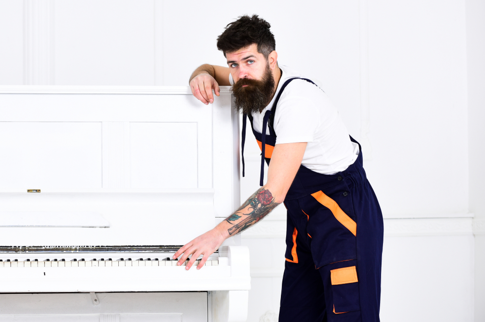 Man,with,beard,and,mustache,,worker,in,overalls,lean,on